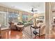 Bright living room featuring hardwood floors, large windows, and a cozy seating arrangement at 2087 Yellowstone Dr, Fort Mill, SC 29707