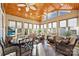 Sunroom with vaulted wood ceiling, tiled floor, wicker furniture, and abundant natural light at 2087 Yellowstone Dr, Fort Mill, SC 29707