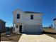 New two-story home featuring a two-car garage, white siding, and a well-manicured lawn at 214 Alden Ct, Shelby, NC 28152