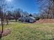 House features a spacious backyard with a large grassy area at 2300 Hamilton Mill Rd, Charlotte, NC 28270