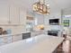 Modern kitchen with white cabinets, quartz countertops, and stainless steel appliances at 2300 Hamilton Mill Rd, Charlotte, NC 28270