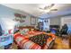 Large bedroom with a bed, gaming setup, and ample storage at 2808 Water Plant Rd, Maiden, NC 28650