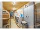 Functional laundry room with washer, dryer, and storage at 2808 Water Plant Rd, Maiden, NC 28650