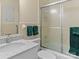 Neutral bathroom featuring a modern vanity, sink, and a shower-tub combo with sliding glass doors at 3 Old Farm Rd, Salisbury, NC 28147