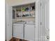 Laundry room with washer, dryer, and overhead storage shelving at 3 Old Farm Rd, Salisbury, NC 28147