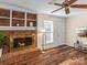 Living room with brick fireplace and hardwood floors at 3 Old Farm Rd, Salisbury, NC 28147