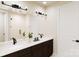 Modern bathroom with double sinks, dark cabinets, and a glass-enclosed shower at 309 Old Town Village Rd, Waxhaw, NC 28173