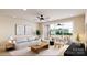Bright living room with modern furniture, a ceiling fan, and sliding doors to an outdoor patio at 309 Old Town Village Rd, Waxhaw, NC 28173