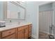 Bathroom with vanity, mirror, and shower at 3976 Stadler Ne Dr, Conover, NC 28613