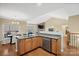Open kitchen with granite island, stainless steel appliances, and hardwood floors at 3976 Stadler Ne Dr, Conover, NC 28613