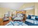 Open-concept living room with hardwood floors and access to kitchen and dining area at 3976 Stadler Ne Dr, Conover, NC 28613