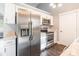 Stainless steel appliances and white cabinets highlight this kitchen at 411 E Old Highway 74 None, Monroe, NC 28112