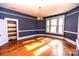 Sunlit dining room, hardwood floors and built-in shelving at 415 S Race St, Statesville, NC 28677