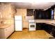 Dated kitchen needing renovation with white appliances at 415 S Race St, Statesville, NC 28677