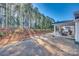 Yard with covered patio and wooded area beyond at 525 Grandiflora Ave # 101, Lancaster, SC 29720