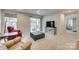 Bright basement recreation room features a TV and patio access at 525 Grandiflora Ave # 101, Lancaster, SC 29720