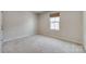 Bright and airy bedroom with carpeted floor at 525 Grandiflora Ave # 101, Lancaster, SC 29720