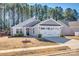 Charming one-story home with gray siding, stone accents, and a two-car garage at 525 Grandiflora Ave # 101, Lancaster, SC 29720