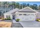 One-story house with gray siding, stone accents, and a two-car garage at 525 Grandiflora Ave # 101, Lancaster, SC 29720