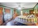 Main bedroom with hardwood floors, ceiling fan and ensuite bathroom at 6117 S New Hope Rd, Belmont, NC 28012