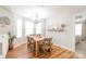 Bright dining room with a wood table and chandelier at 6416 Park Pond Dr, Charlotte, NC 28262