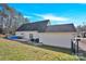 Spacious backyard with a patio seating area, pool, and large green grass at 7918 Ridgeview Dr, Sherrills Ford, NC 28673