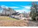 Large backyard with a patio, pool, trampoline, play set, and a fenced perimeter at 7918 Ridgeview Dr, Sherrills Ford, NC 28673
