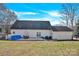 Large backyard featuring a patio with seating, a small pool, a grill, and an attached garage at 7918 Ridgeview Dr, Sherrills Ford, NC 28673