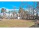Spacious backyard with storage shed and wooded area at 7918 Ridgeview Dr, Sherrills Ford, NC 28673