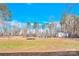 Fenced backyard with a trampoline and shed with a small section of green grass in view at 7918 Ridgeview Dr, Sherrills Ford, NC 28673