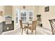 Cozy breakfast nook with a round table set by bay windows, complemented by chalkboard wall and decor at 7918 Ridgeview Dr, Sherrills Ford, NC 28673