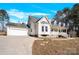 View of home showcasing the attached garage and side yard at 7918 Ridgeview Dr, Sherrills Ford, NC 28673