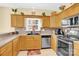 Well-lit kitchen with stainless steel appliances, tile backsplash, and granite countertops at 7918 Ridgeview Dr, Sherrills Ford, NC 28673