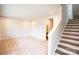 Cozy carpeted living area with neutral paint and staircase at 7944 Cedarsmith Ct, Charlotte, NC 28217