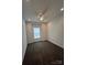 Bright bedroom features plush carpeting, a ceiling fan, and a window bringing in natural light at 819 Wellwood Ave, Statesville, NC 28677