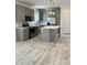 Modern kitchen with gray cabinets, stainless steel appliances, and a central island at 819 Wellwood Ave, Statesville, NC 28677