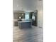 Well-lit kitchen with gray cabinets, stainless steel appliances, and a center island with white countertop at 819 Wellwood Ave, Statesville, NC 28677