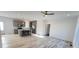 Open-concept living space featuring a kitchen island, stainless appliances, and hardwood flooring at 819 Wellwood Ave, Statesville, NC 28677