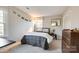 Cozy bedroom with double bed and wood dresser at 8620 Kirchenbaum Dr, Charlotte, NC 28210