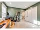 Spacious home office with wood desk and built-in shelving at 8620 Kirchenbaum Dr, Charlotte, NC 28210