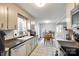 Galley kitchen with stainless steel appliances and tile floors at 8620 Kirchenbaum Dr, Charlotte, NC 28210