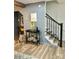 Bright entryway showcasing a modern staircase and tasteful decor at 8838 Hunter Ridge Dr, Charlotte, NC 28226