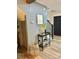 Inviting entryway with stylish console table, storage basket, and modern staircase at 8838 Hunter Ridge Dr, Charlotte, NC 28226