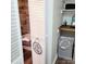 Bright laundry room with built-in shelving and a convenient drop-down ironing board at 8838 Hunter Ridge Dr, Charlotte, NC 28226