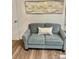 Cozy living room with a light-grey loveseat and decorative throw pillow at 8838 Hunter Ridge Dr, Charlotte, NC 28226