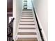 Modern staircase with clean lines and wooden treads, leading to upper level at 8838 Hunter Ridge Dr, Charlotte, NC 28226
