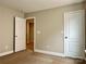 Bedroom with neutral walls, carpet, and white doors at 9034 Seamill Rd, Charlotte, NC 28278