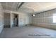 Spacious unfinished garage with high ceilings and ample storage space at 1104 Verdigris Dr # 803/0803, Gastonia, NC 28054