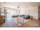 Finished basement with grey sectional sofa, and sliding glass doors at 1214 S Kings Dr # A, Charlotte, NC 28207