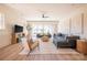 Finished basement with grey sectional sofa, and sliding glass doors at 1214 S Kings Dr # A, Charlotte, NC 28207